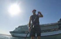 VIDEO: Outdoor Ethusiast Paddles Around Massive Cruise Ship